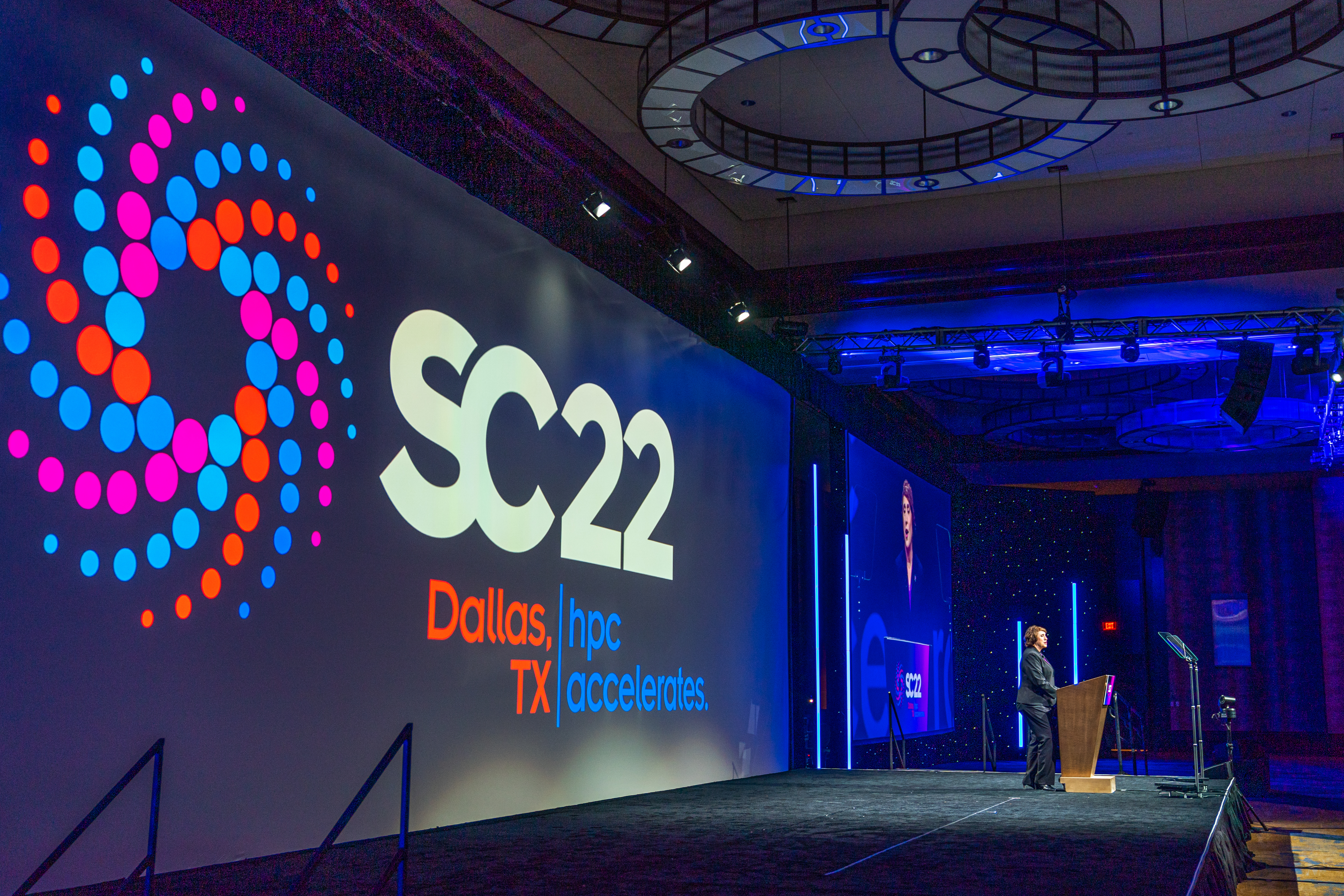 Woman on stage presenting at SC22 conference